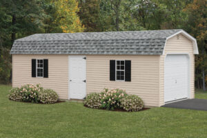 dutch barn garage with tan siding